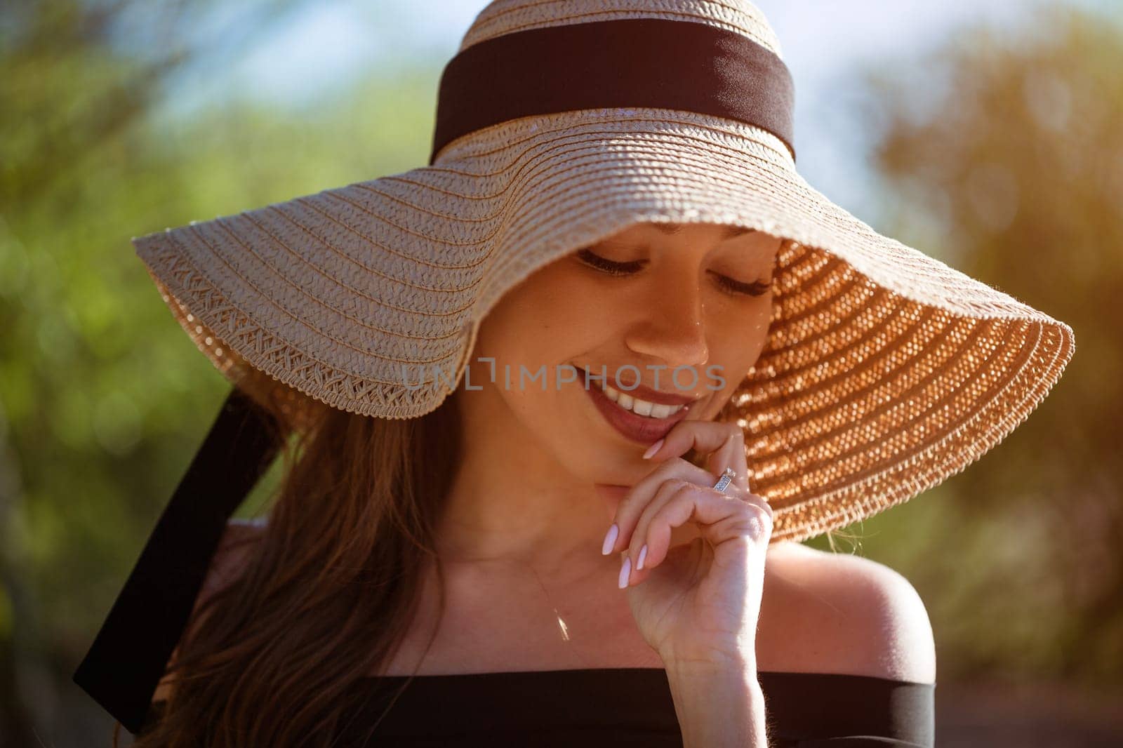 Young woman in sun hat close up by EkaterinaPereslavtseva