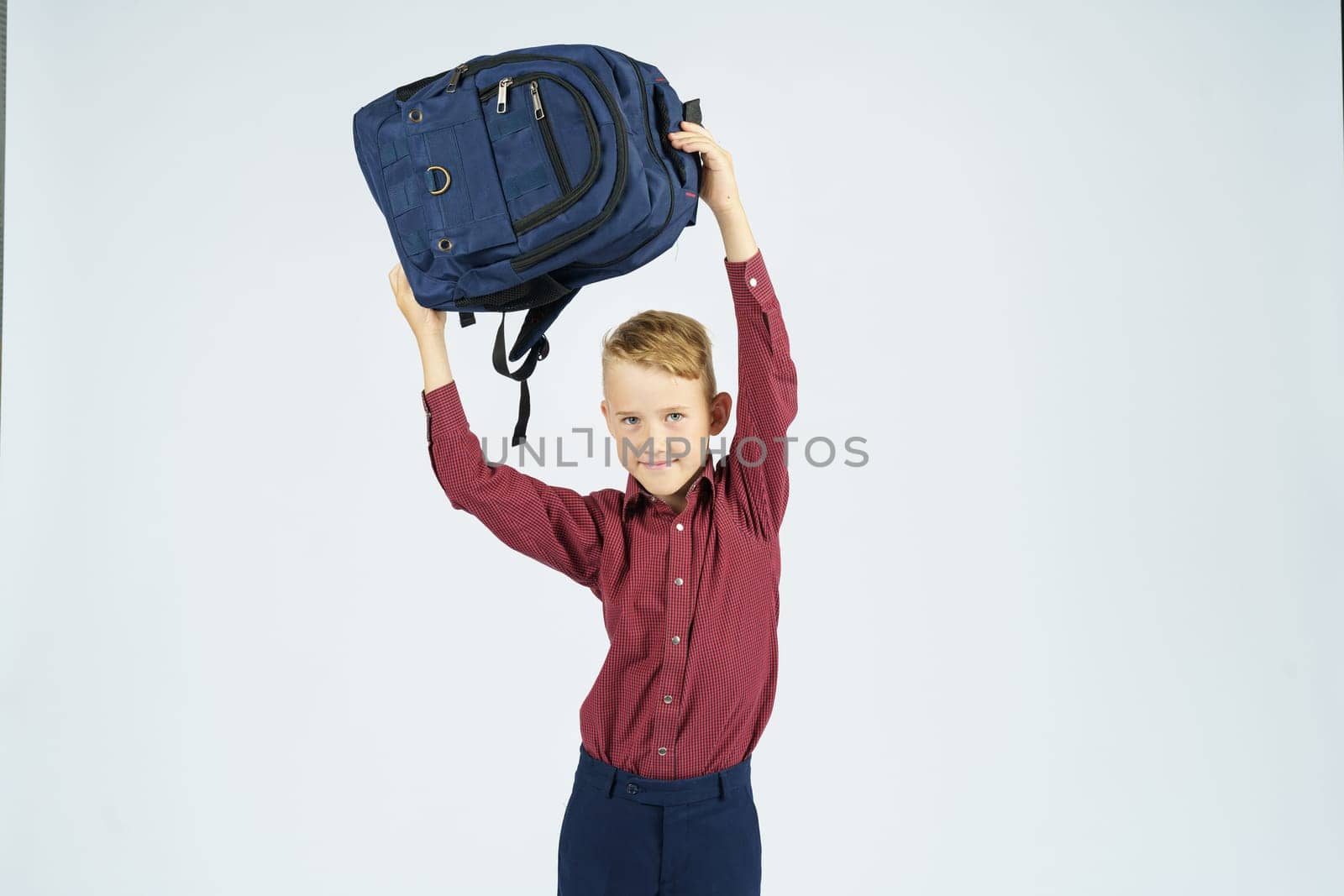 A schoolboy holds a schoolbag over his head. by Sd28DimoN_1976