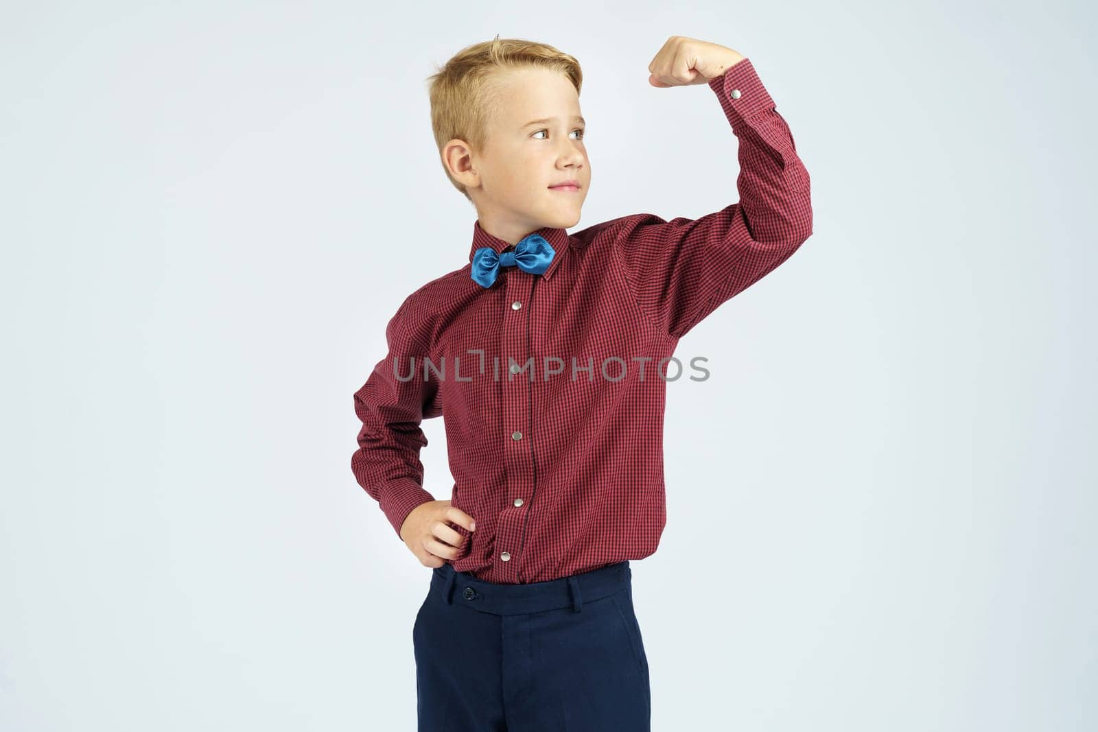 A portrait of a schoolboy who demonstrates his strength. Isolated background. by Sd28DimoN_1976