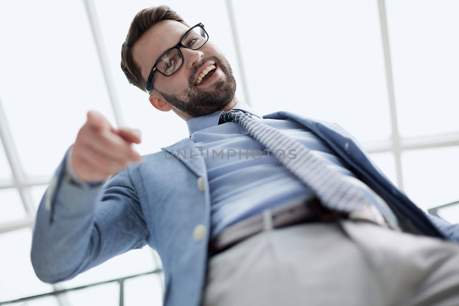 Portrait of a confident young man pointing his finger