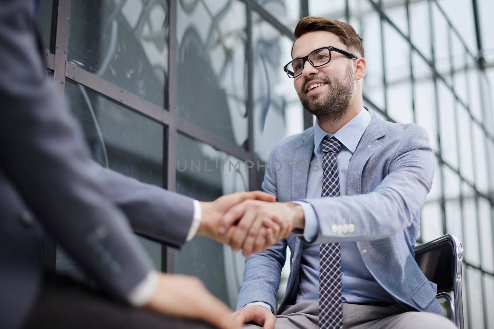 Closeup of business shaking hands over a deal