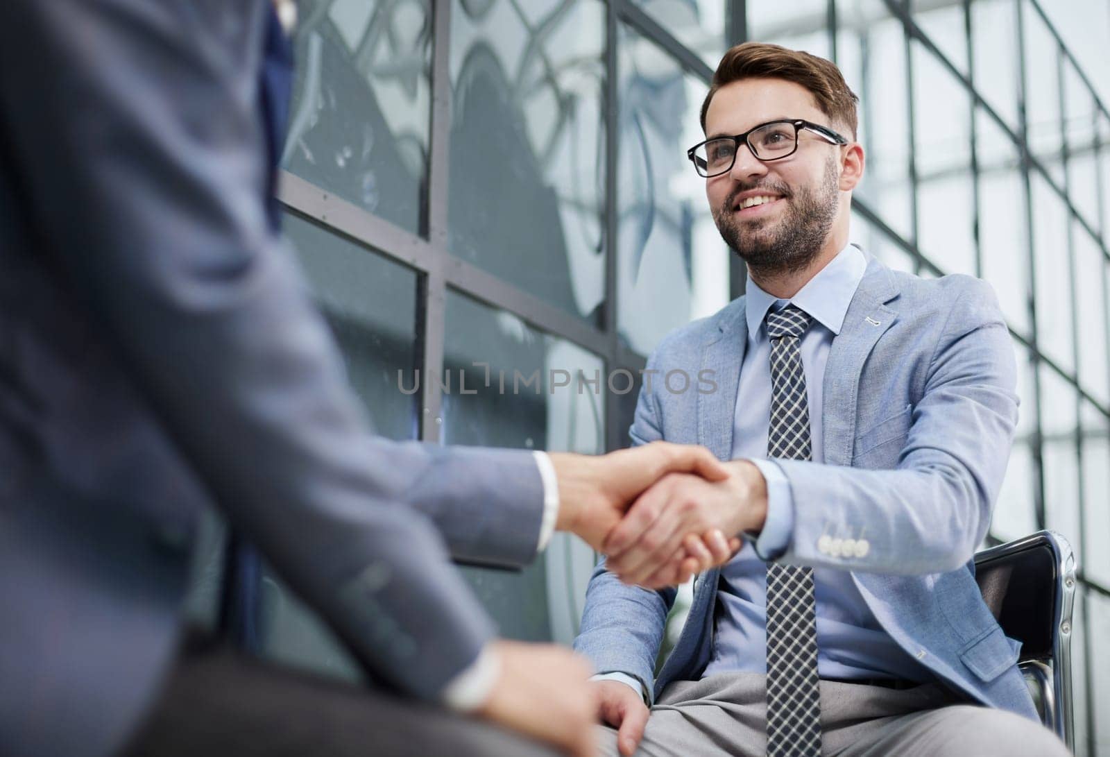 Closeup of business shaking hands over a deal