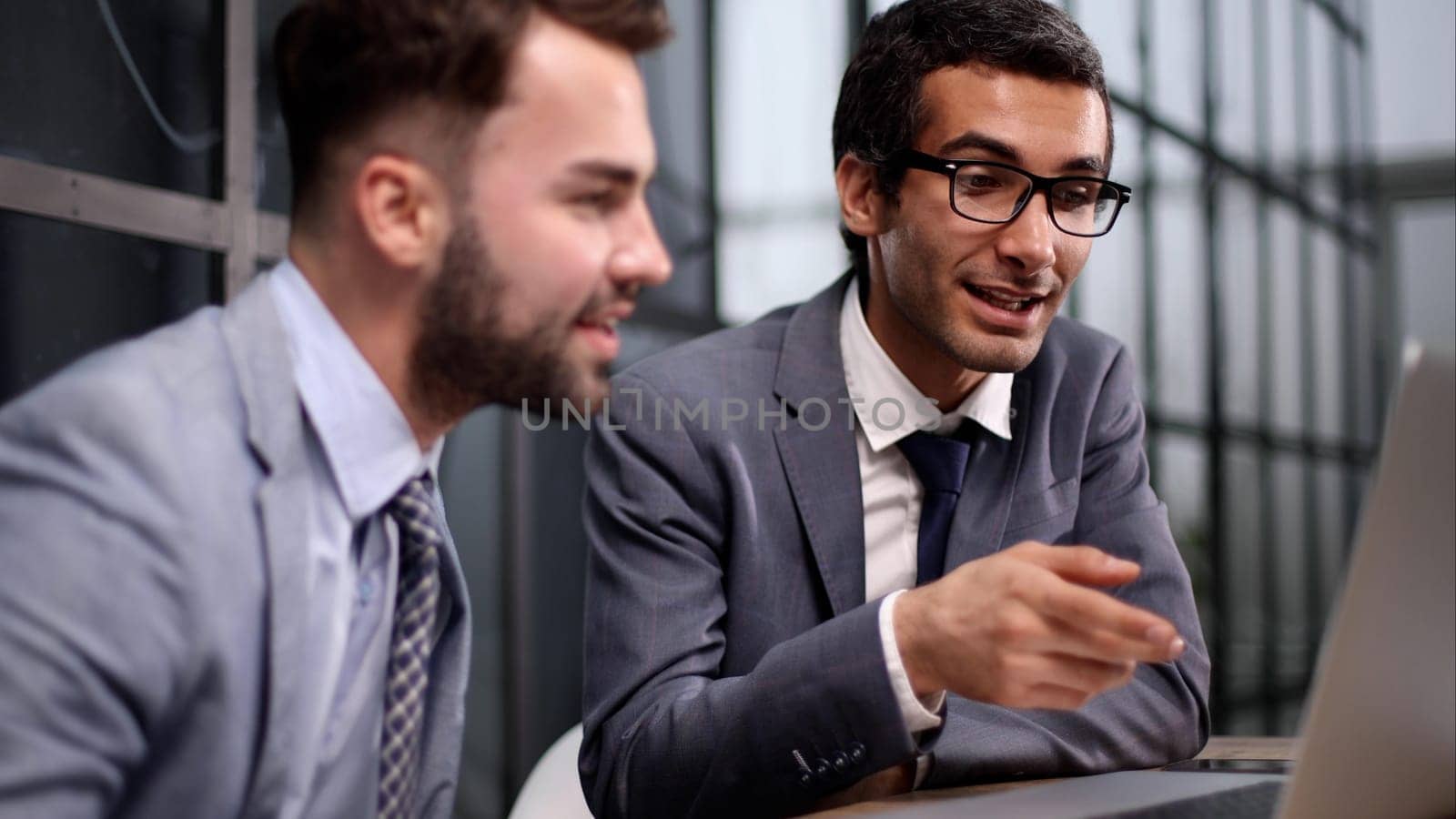 team of businesspeople having a meeting around a table