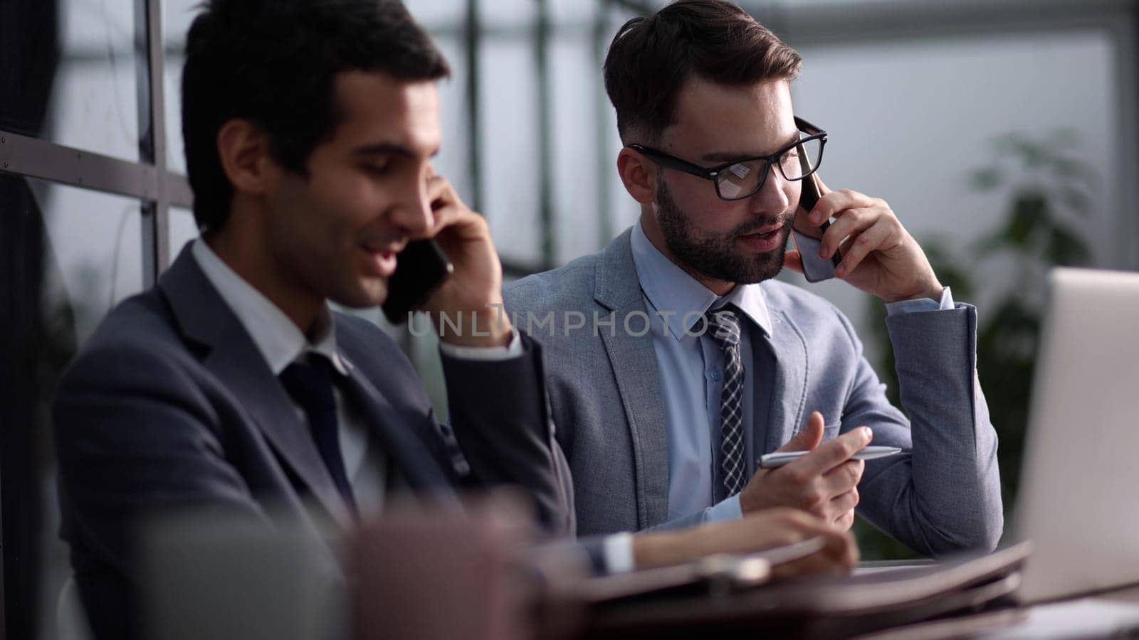 Young business people working in the office with a laptop on the table