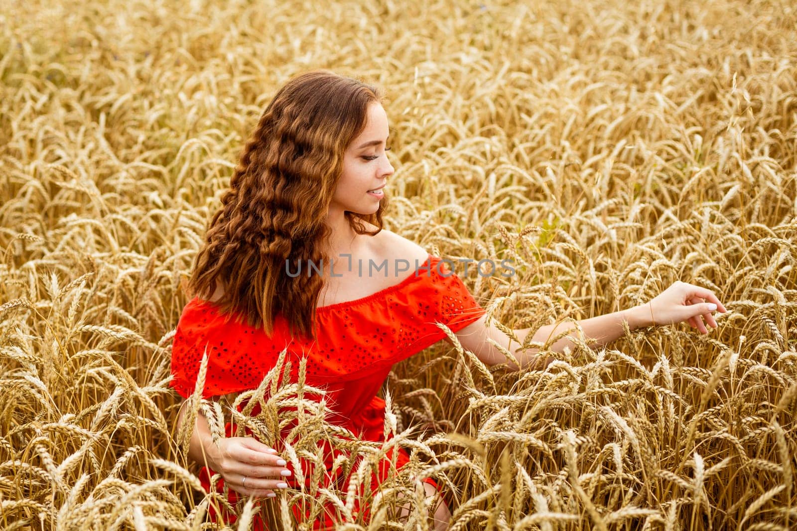 Style redhead girl in dress tay on yellow wheat field . by EkaterinaPereslavtseva