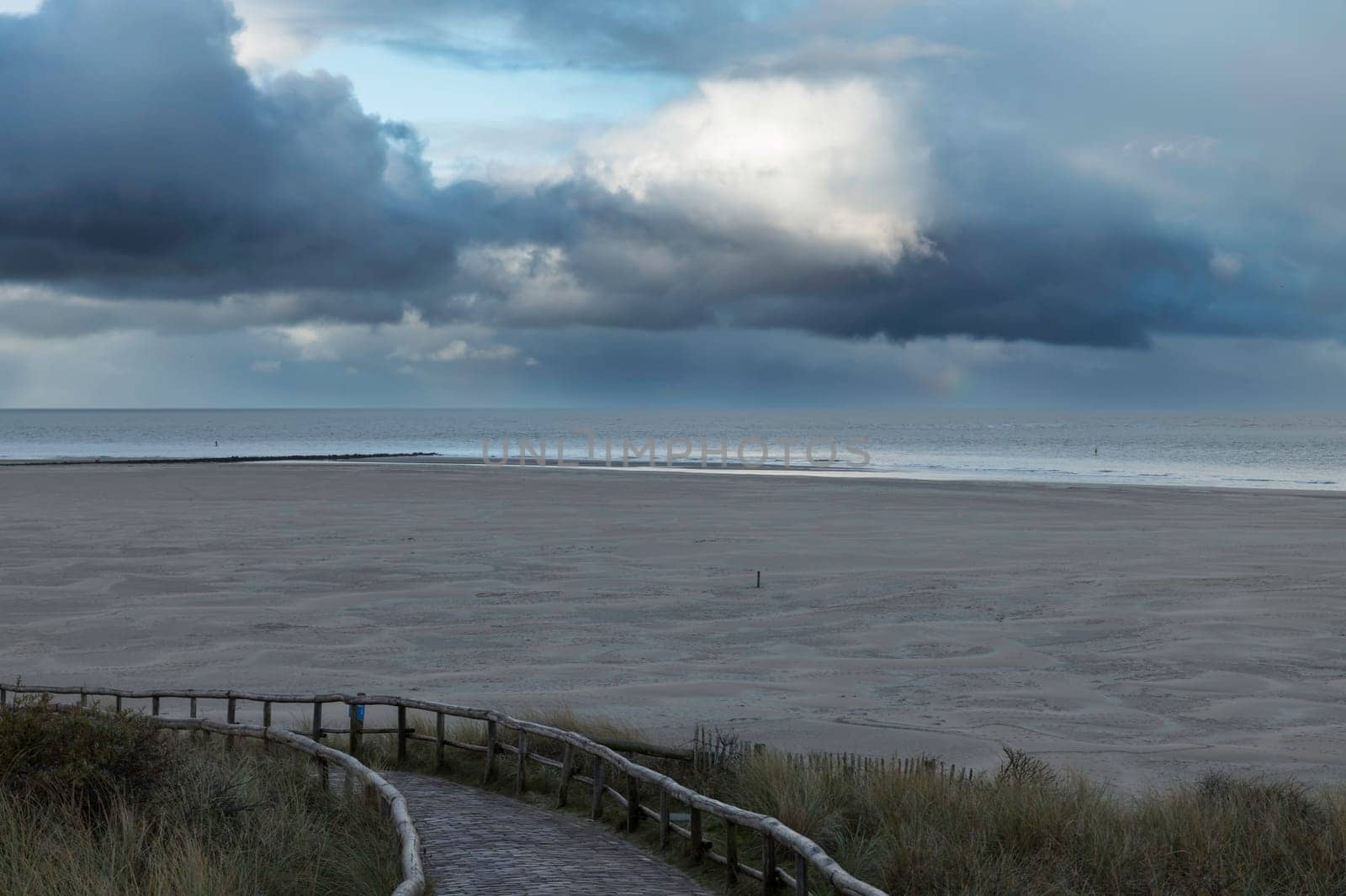 the road to the beach of Texel with the wide beach and the Wadden Sea by compuinfoto
