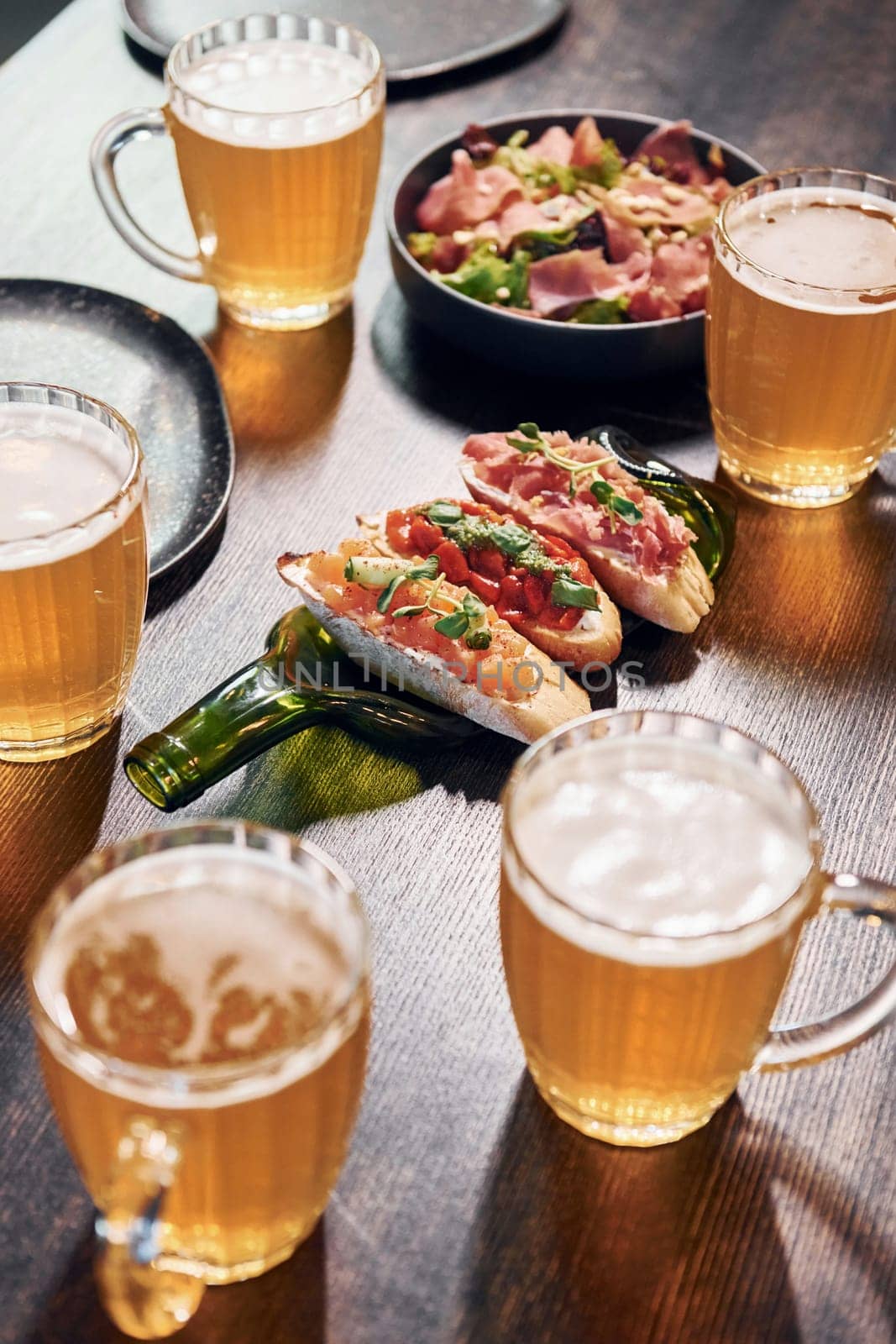 Close up view of food and beer on the table.