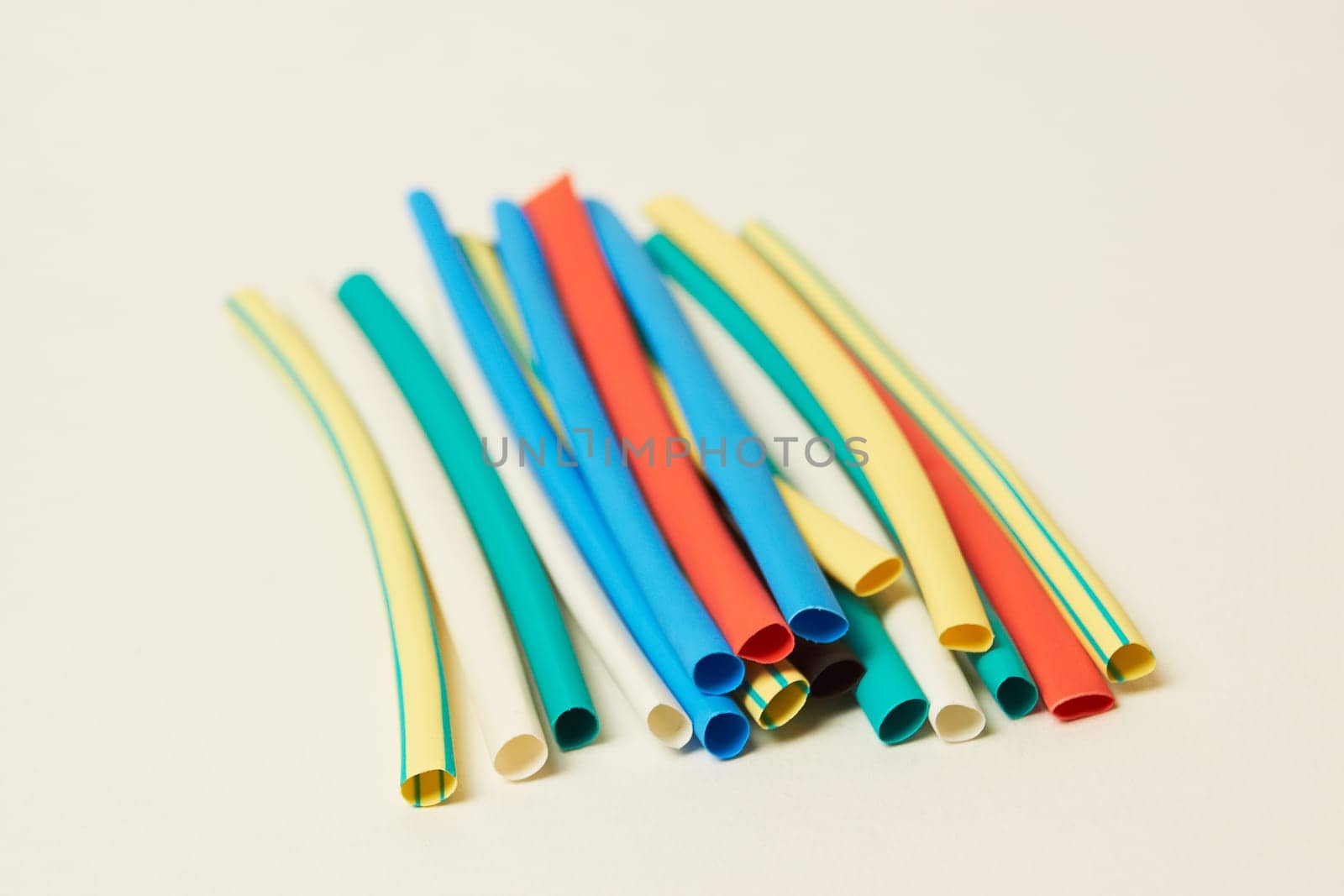 Multicolored shrink tube on a white background tubes of different colors