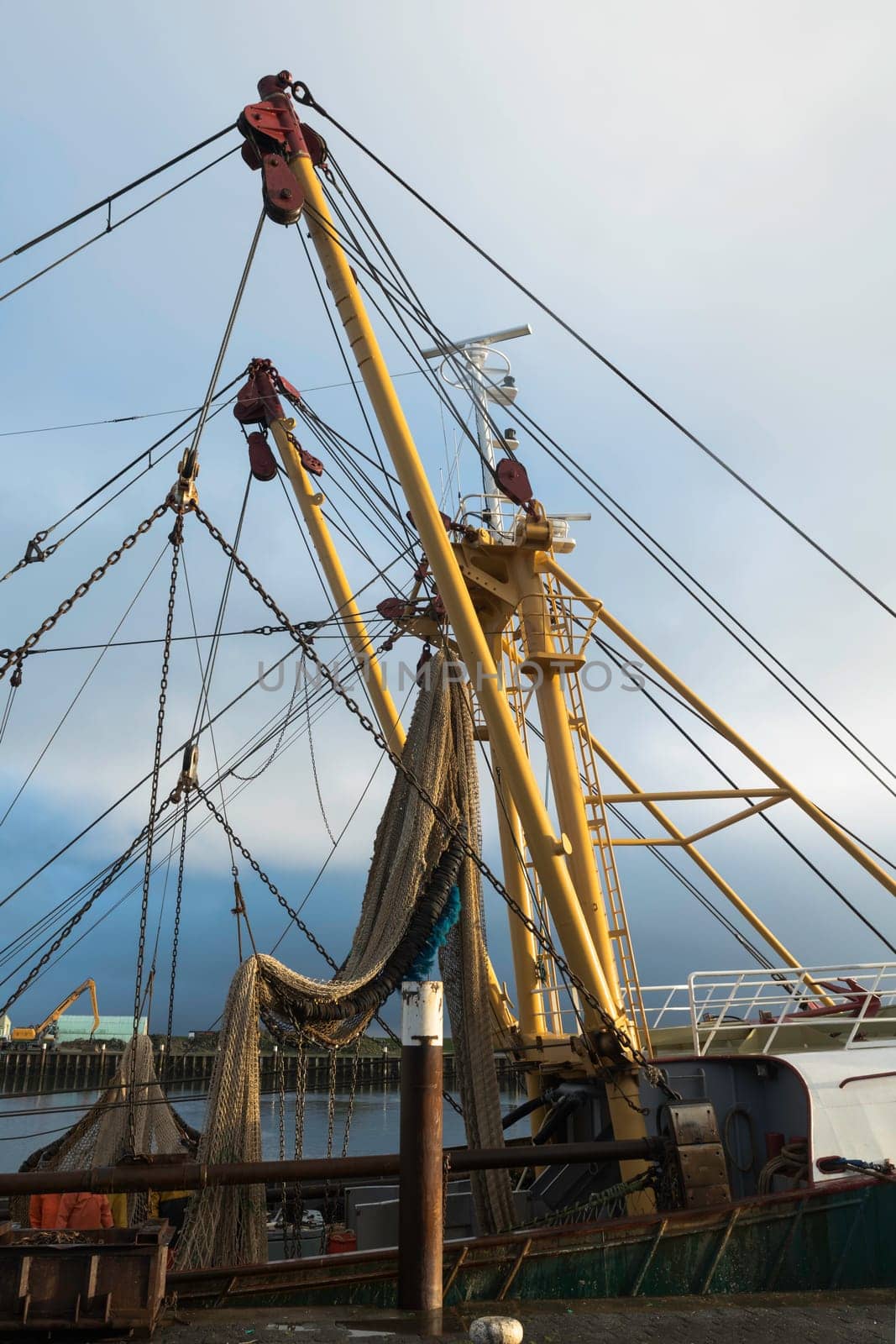 fishing boat in the harbor of Texel by compuinfoto