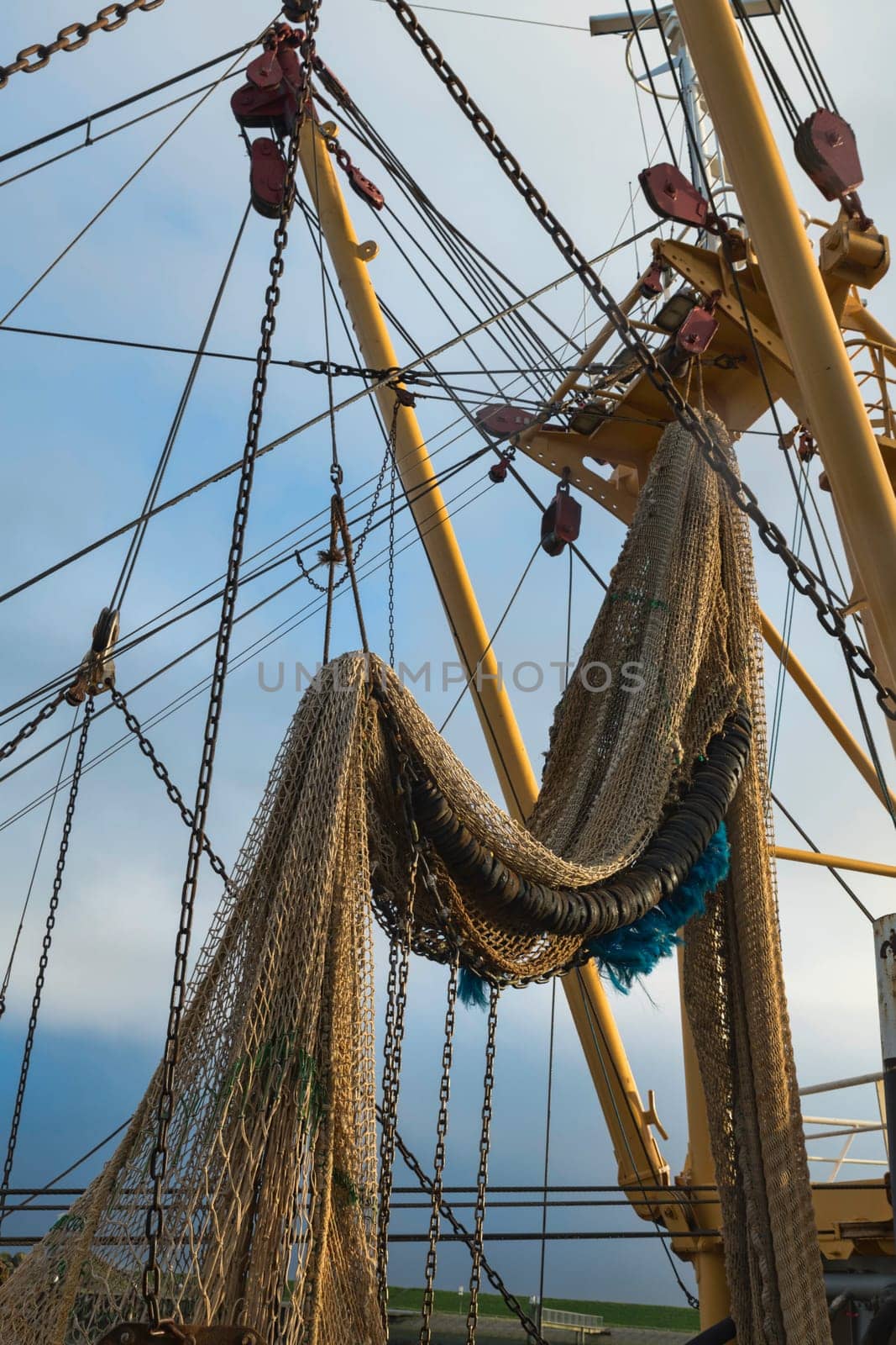 fishing boat in the harbor of Texel by compuinfoto