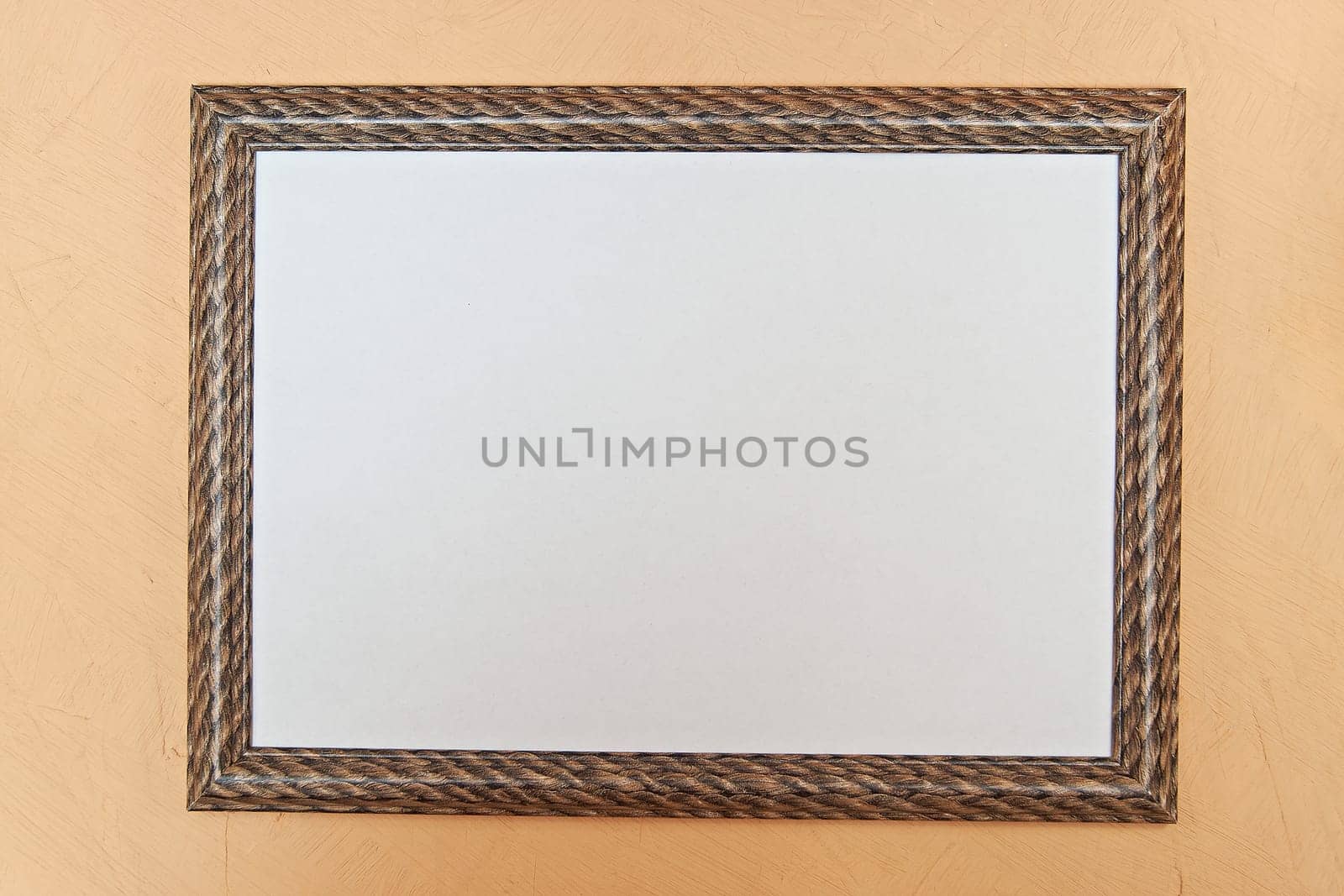 Photo frame with single white image on pink wall