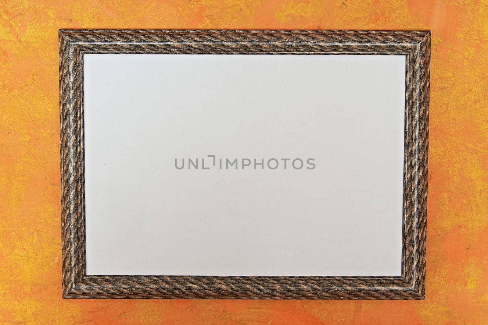 wooden photo frame with a white image on a bright orange background