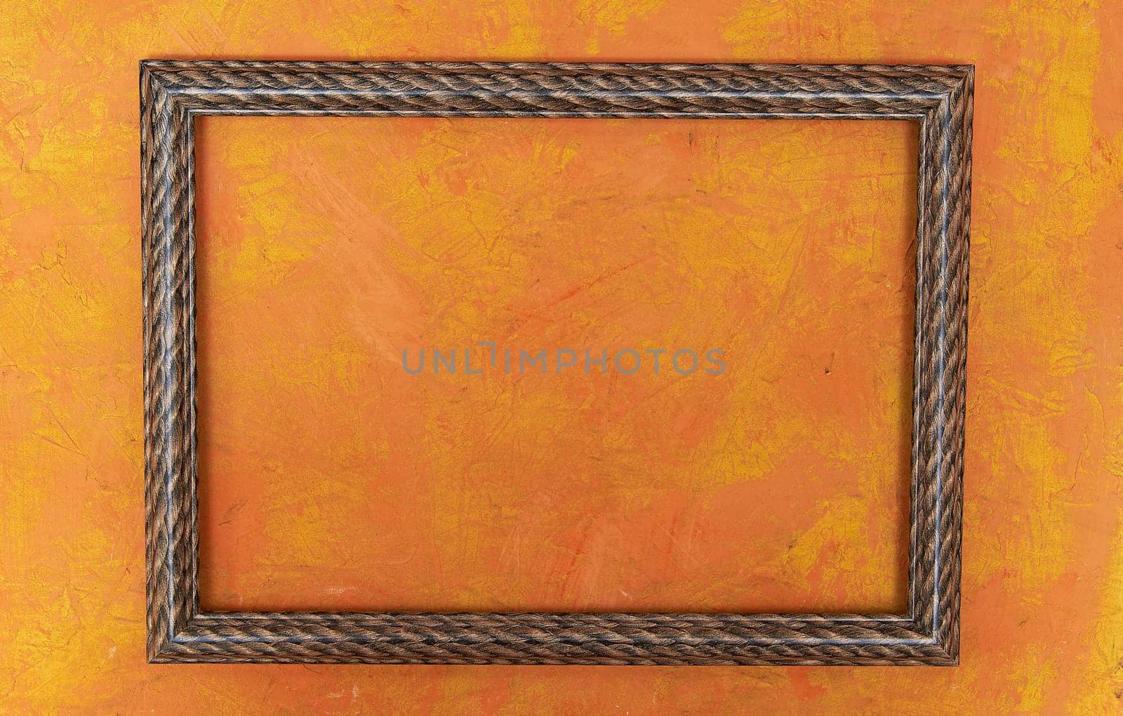 wooden photo frame on bright orange background