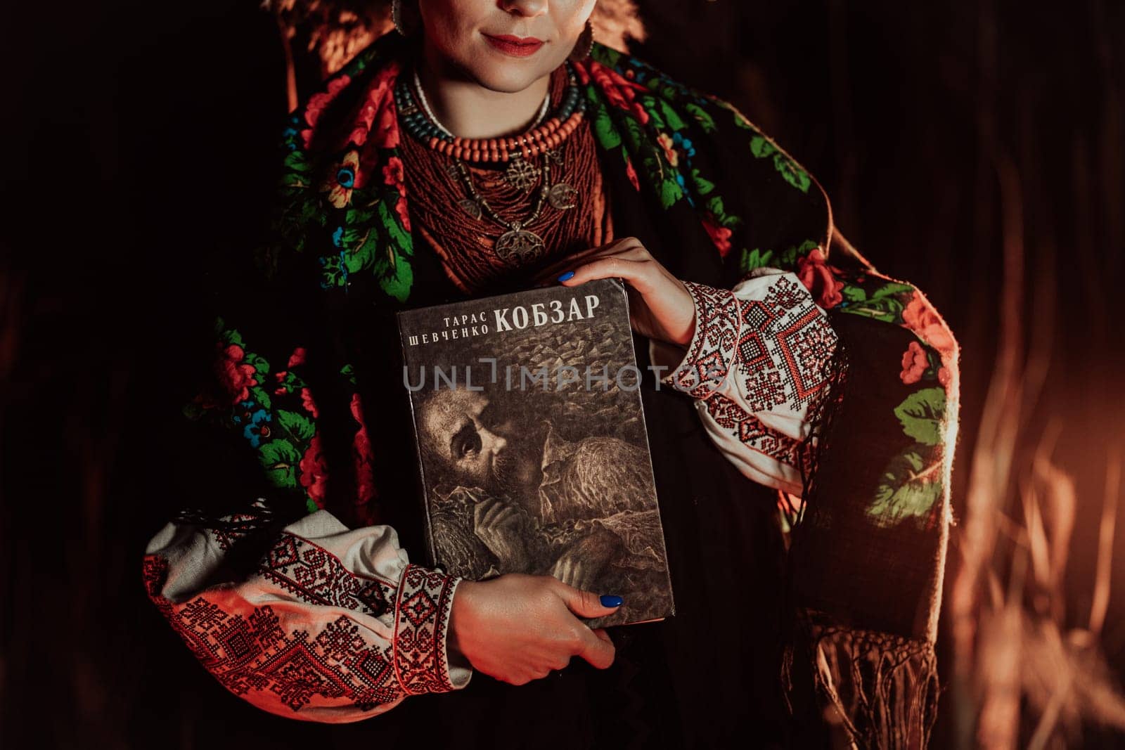 Woman holding Kobzar - poetry book collection of Taras Shevchenko - poet, bard in Ukrainian culture.