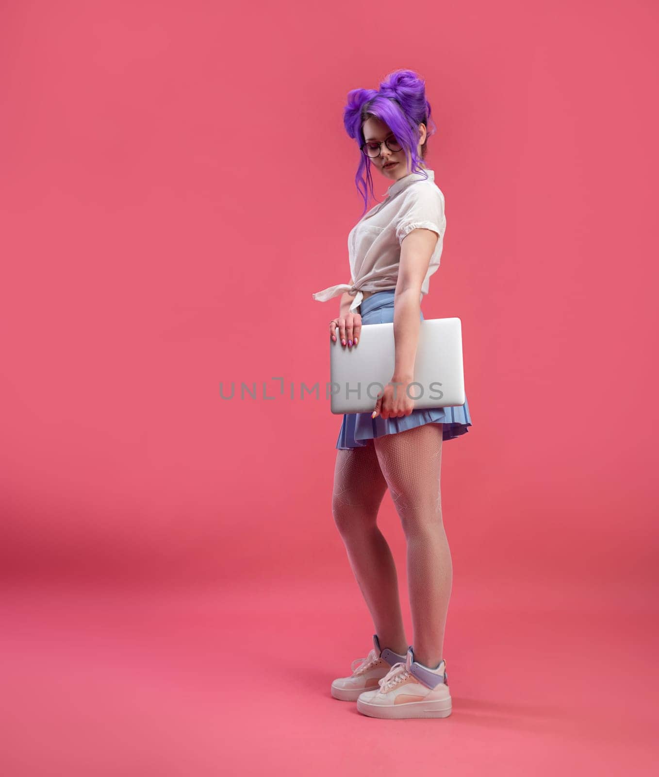 sexy girl with glasses with purple hair with a laptop in summer clothes on a pink background copy paste by Rotozey