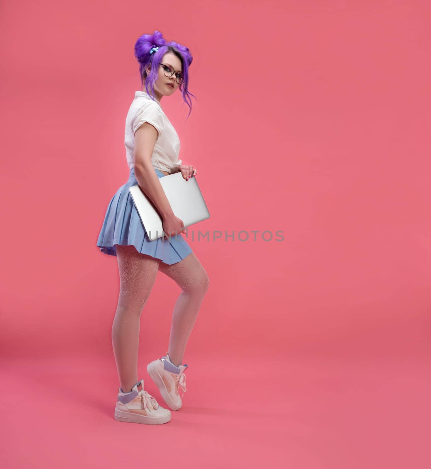 sexy girl with glasses with purple hair with a laptop in summer clothes on a pink background copy paste by Rotozey