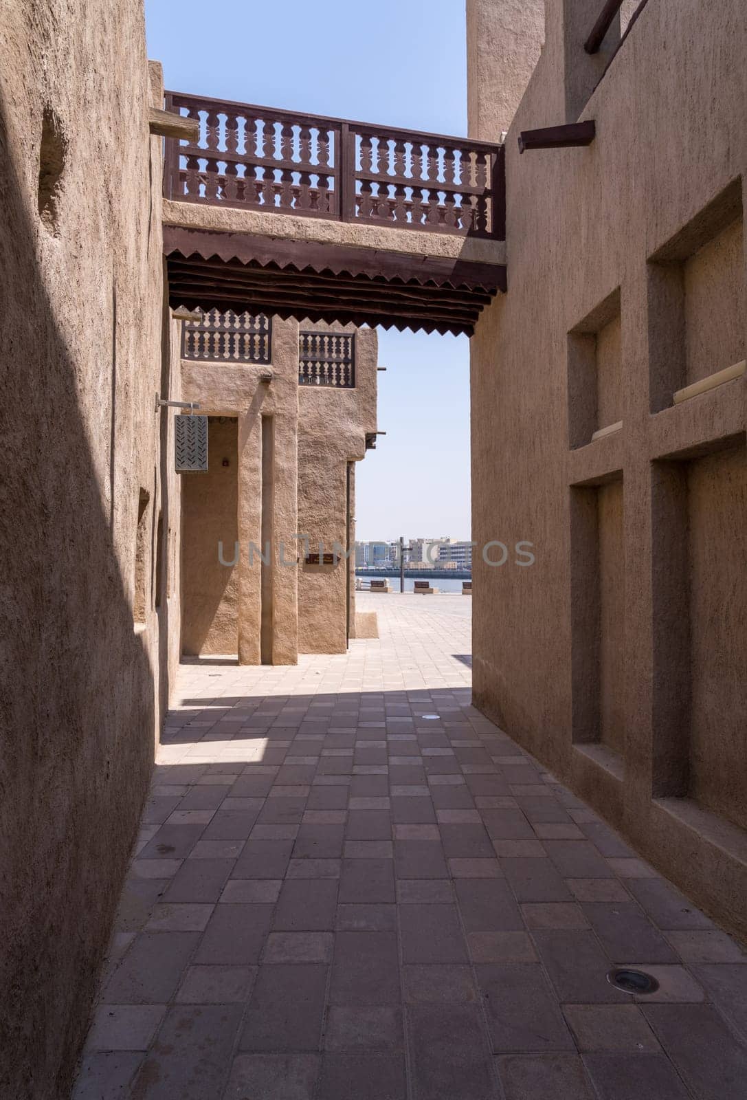 Narrow street in Al Shindagha district and museum in Dubai by steheap