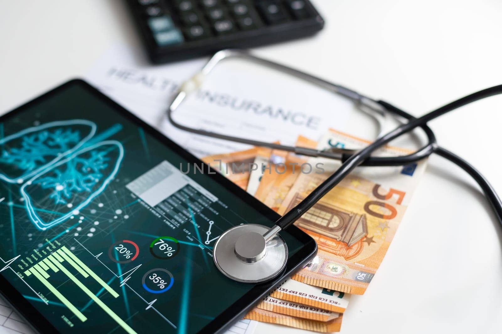 Paper with text Health insurance on the table with stethoscope by Andelov13