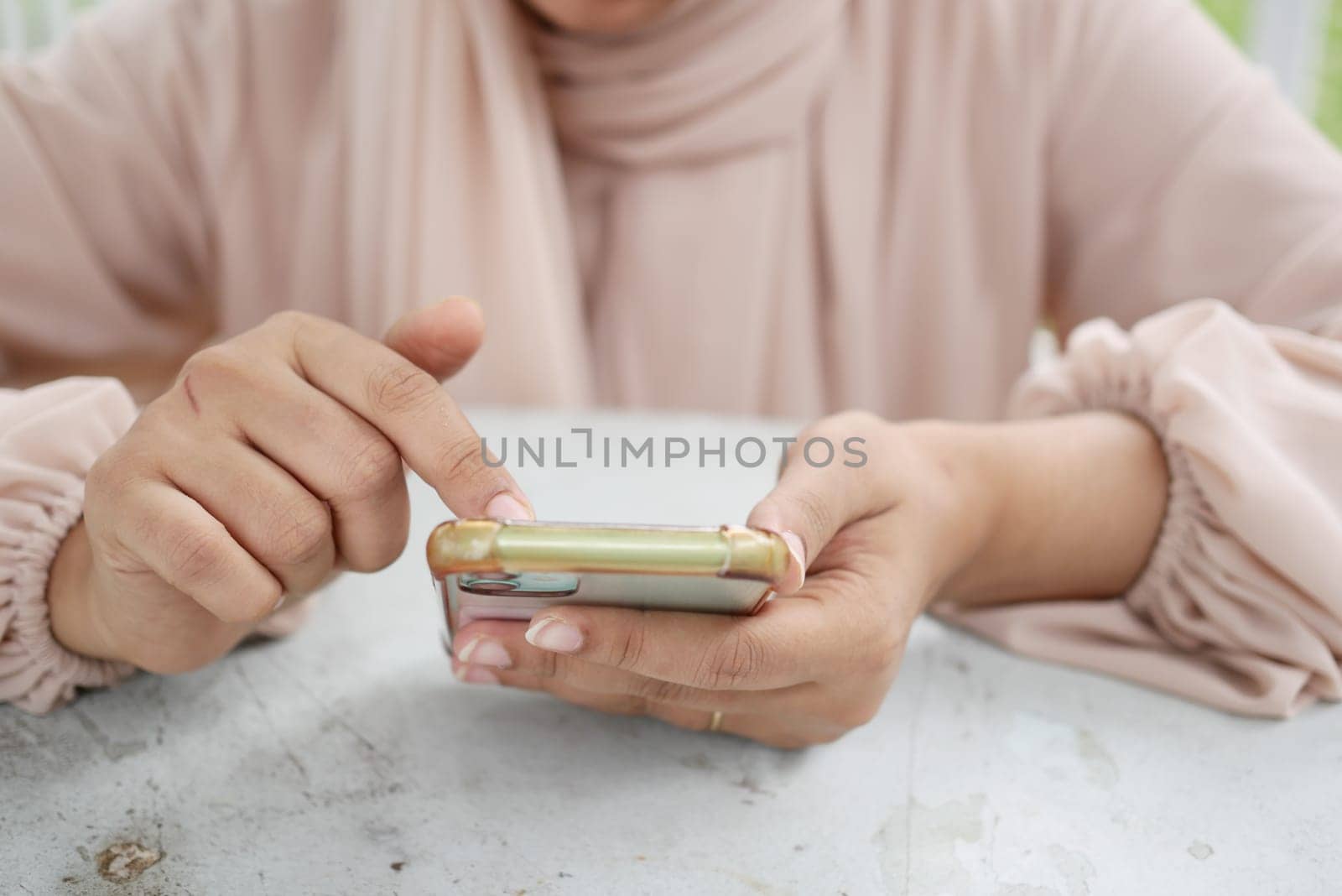 close up of women hand holding smart phone.