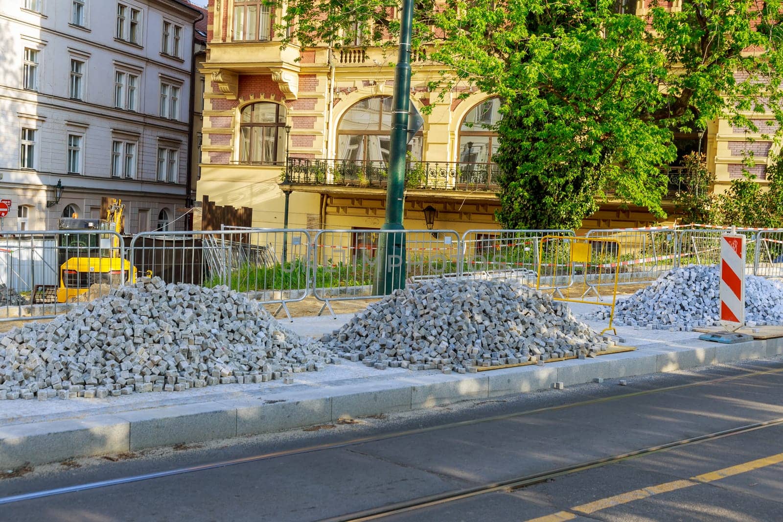 A pile of European square white paving stones at a construction site in Prague, Czech Republic. Construction of sidewalks.