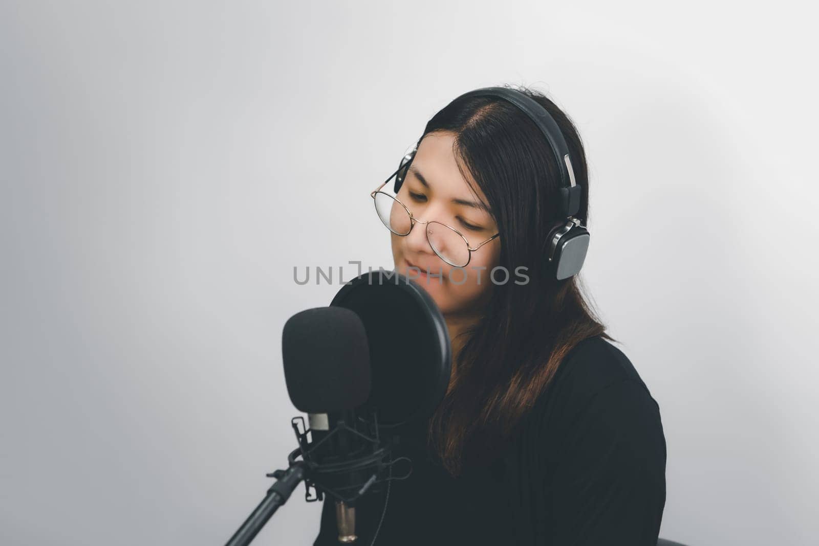 Woman (LGBTQ) singer sing a song with microphone by NongEngEng