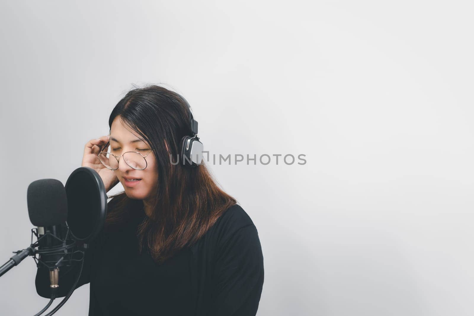 Woman (LGBTQ) singer sing a song with microphone by NongEngEng