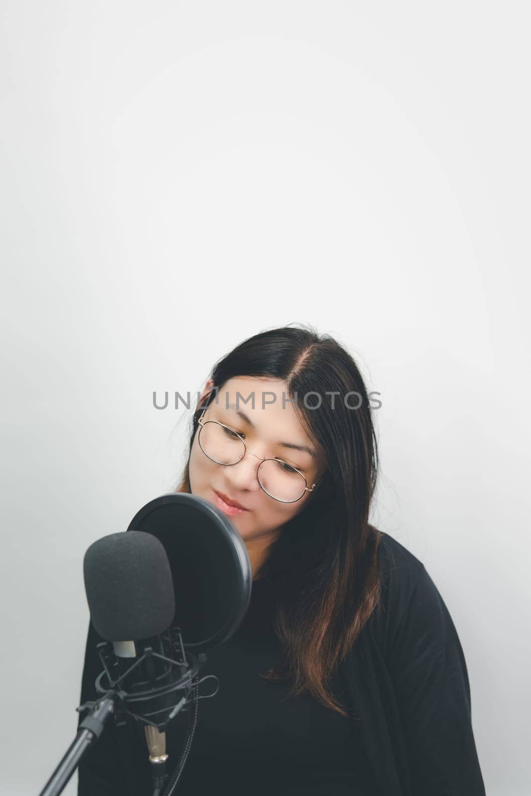 Woman (LGBTQ) singer sing a song with microphone by NongEngEng