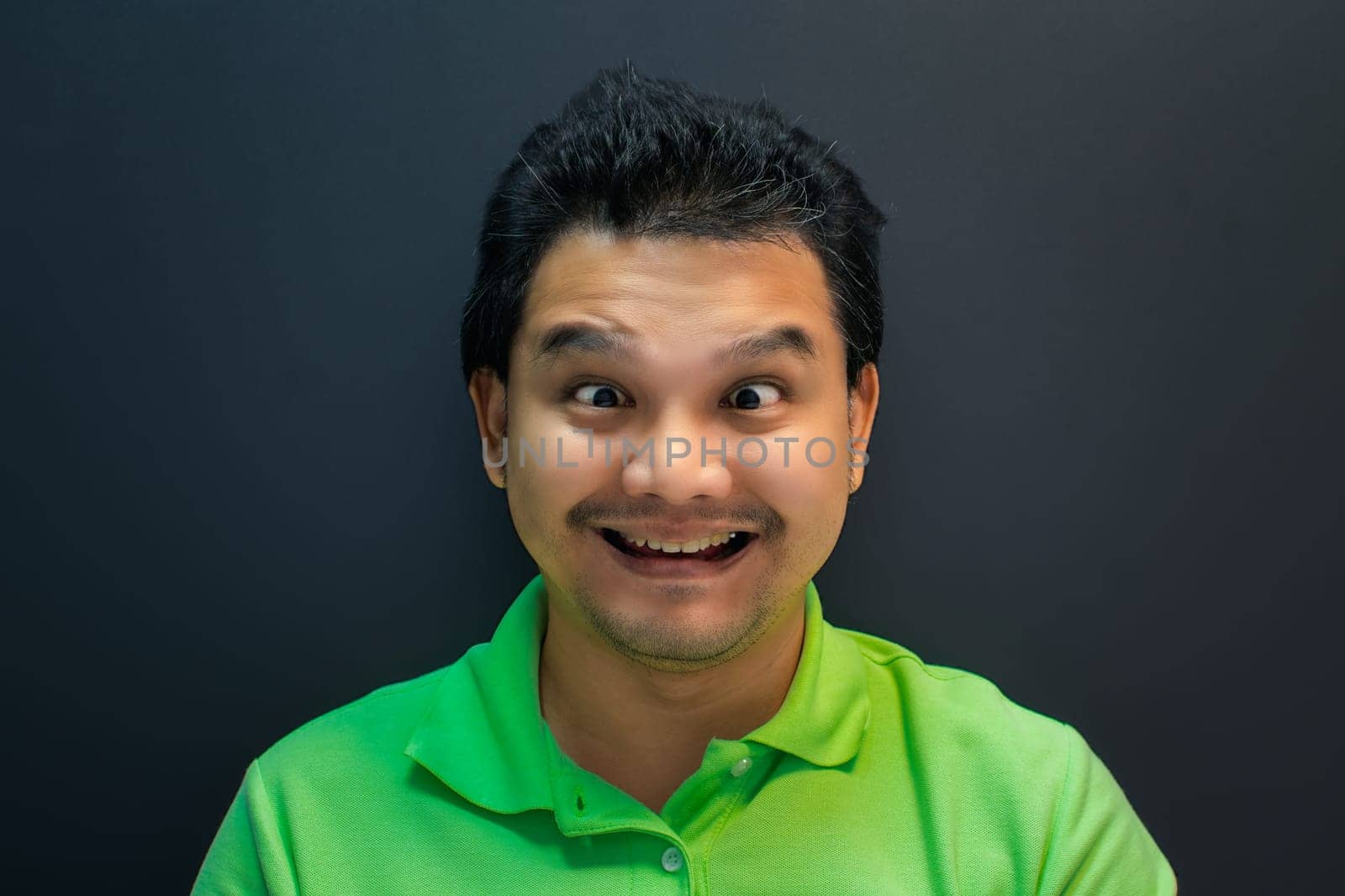 Asian man smile have crazy squintin with confusion by PongMoji