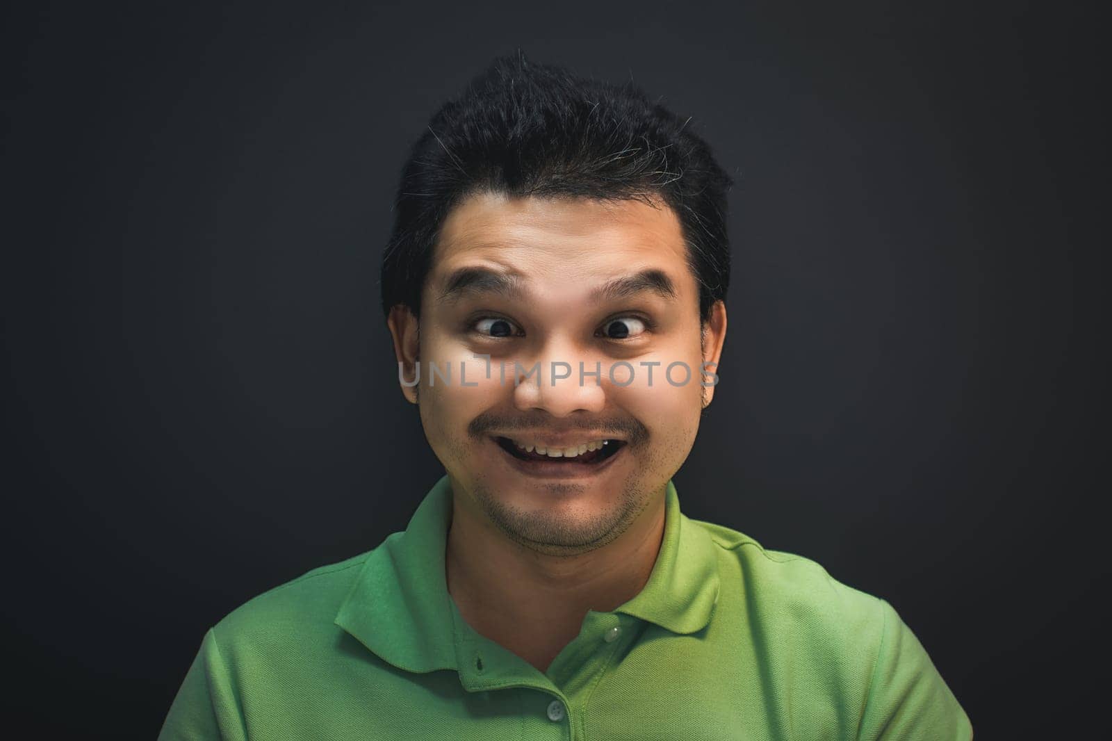 Asian man smile have crazy squintin with confusion by PongMoji