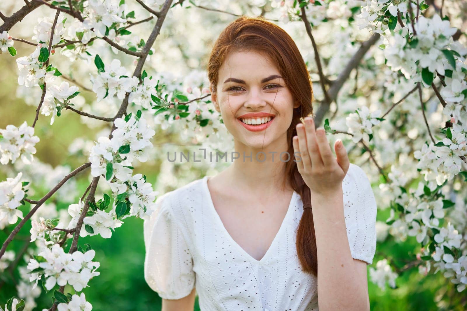 Spring woman in summer dress walking in park. High quality photo