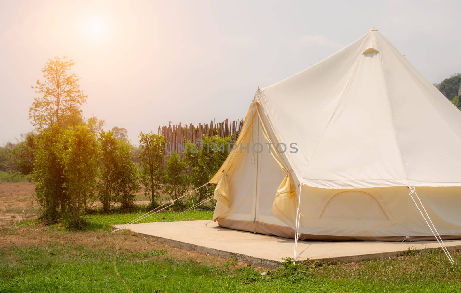 Camping picnic tent campground in outdoor hiking forest. Camper while campsite in nature background at summer trip camp. Adventure Travel Vacation concept