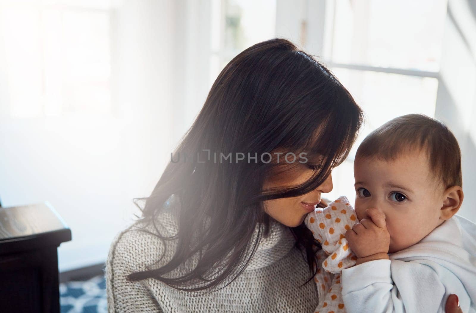So beautiful, that mother daughter bond. an adorable baby girl bonding with her mother at home. by YuriArcurs