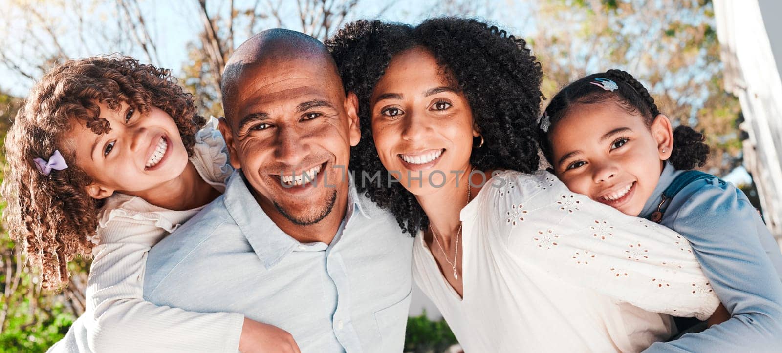 Family, children and portrait outdoor with parents in nature with love and care. Happy kids, man and woman together for support, piggyback or quality time with hug and smile for happiness or security by YuriArcurs