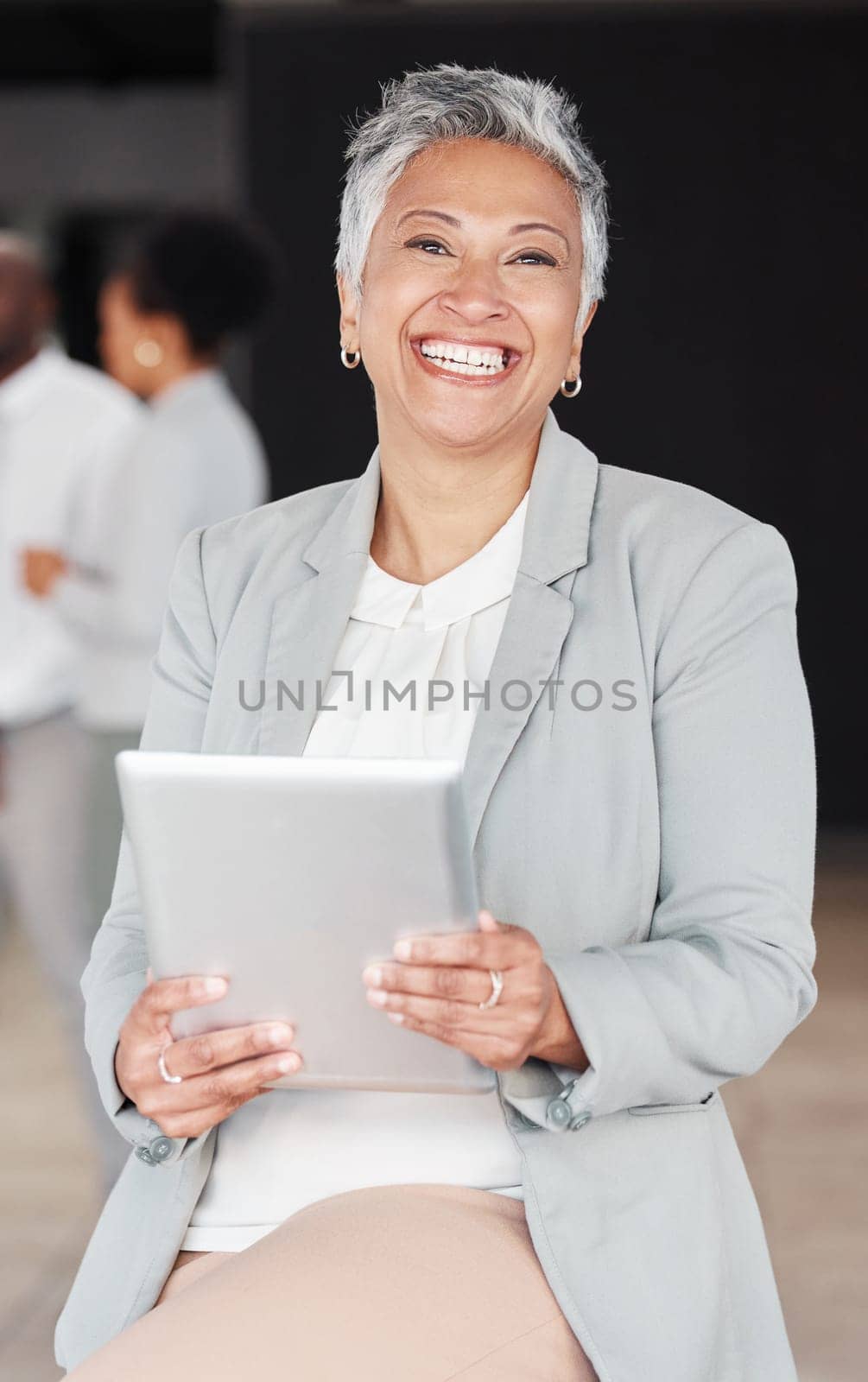 Happy, corporate and portrait of a woman with a tablet for an email, communication or internet. Smile, mature and an executive manager working on technology at a company for research and the web by YuriArcurs