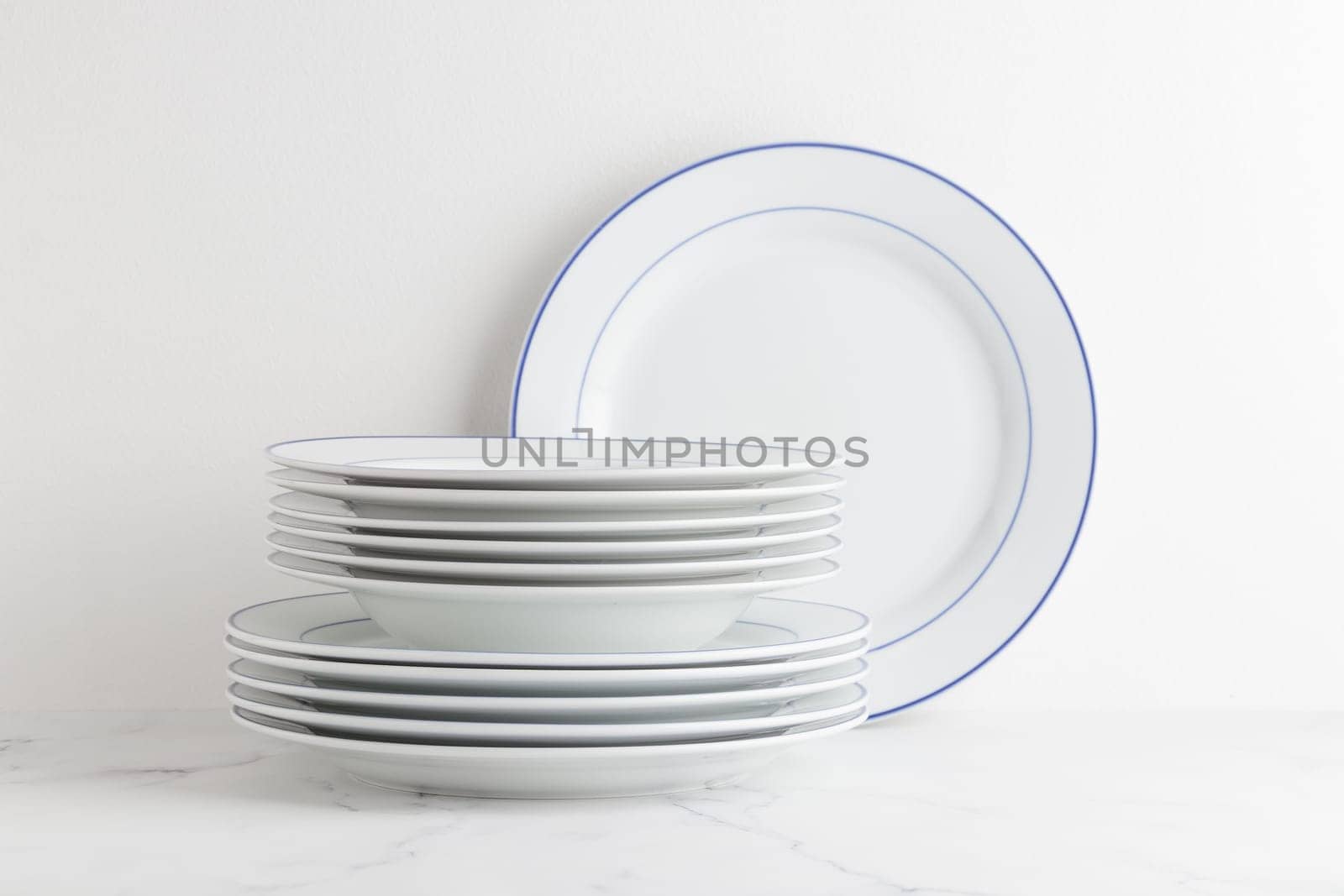 Clean white dinner set of plates on a white background