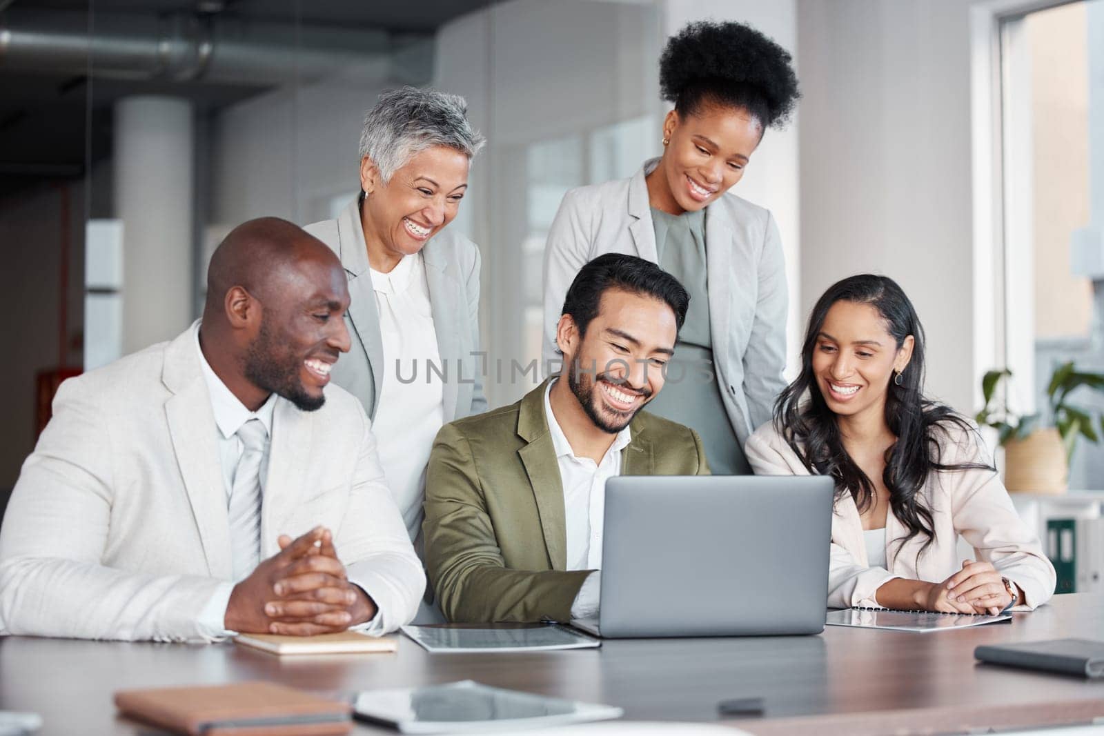 Business people, laptop and meeting in teamwork, collaboration or corporate webinar at the office. Happy diverse group of employees working on computer together for team conference at the workplace.