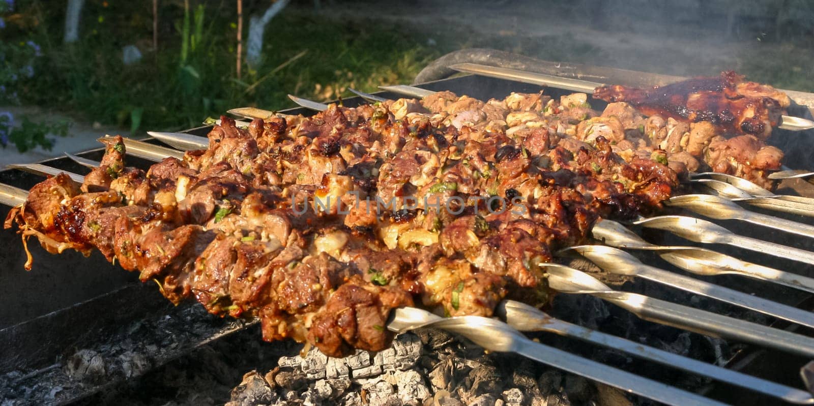 Pork Meat on skewers grilled on the grill, delicious food by Hydrobiolog