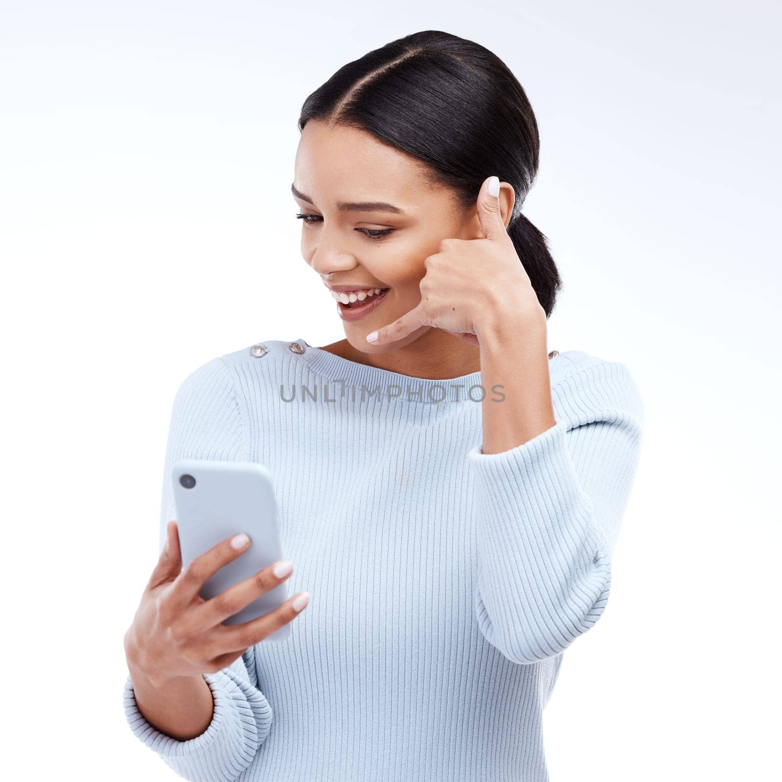 Phone call, sign and woman isolated on a white background for networking, contact and communication on mobile app. Happy young person talking, hello or conversation on cellphone service in studio.
