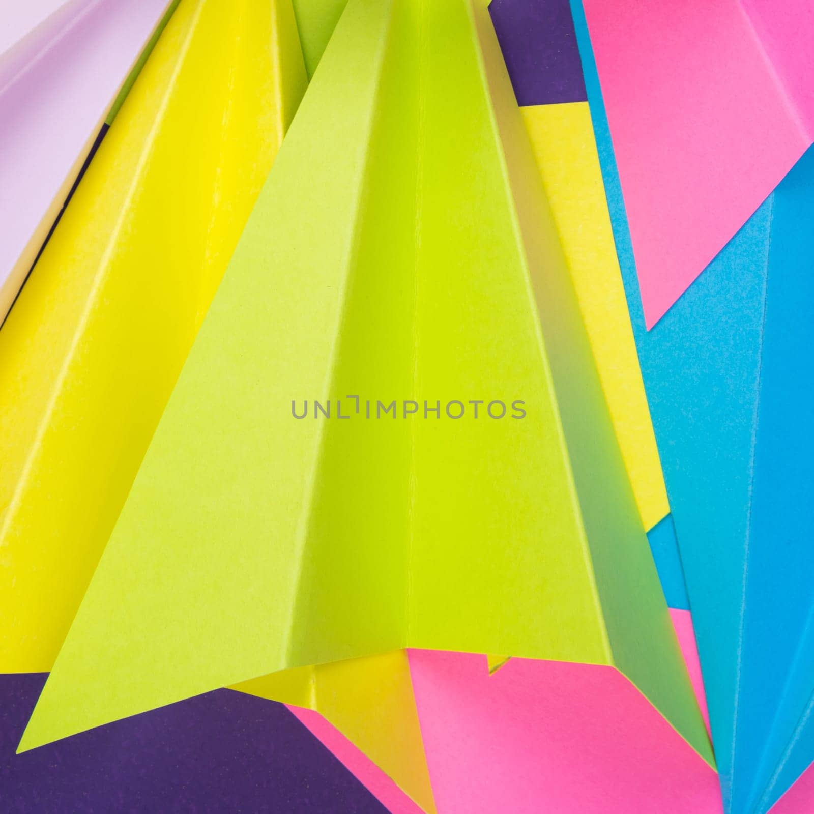 A closeup shot of colorful handmade paper planes by A_Karim