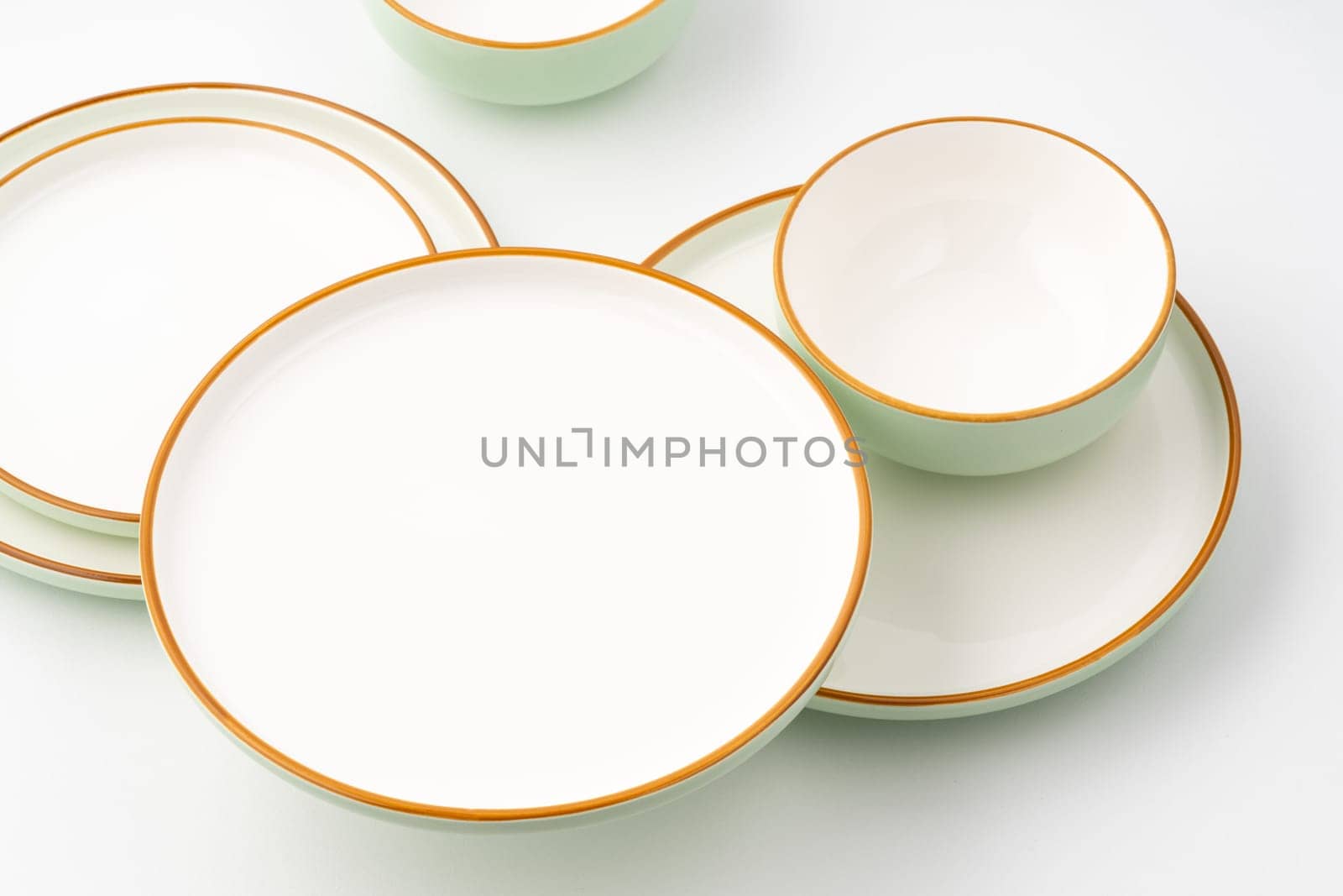 A set of ceramic tableware isolated on white background by A_Karim