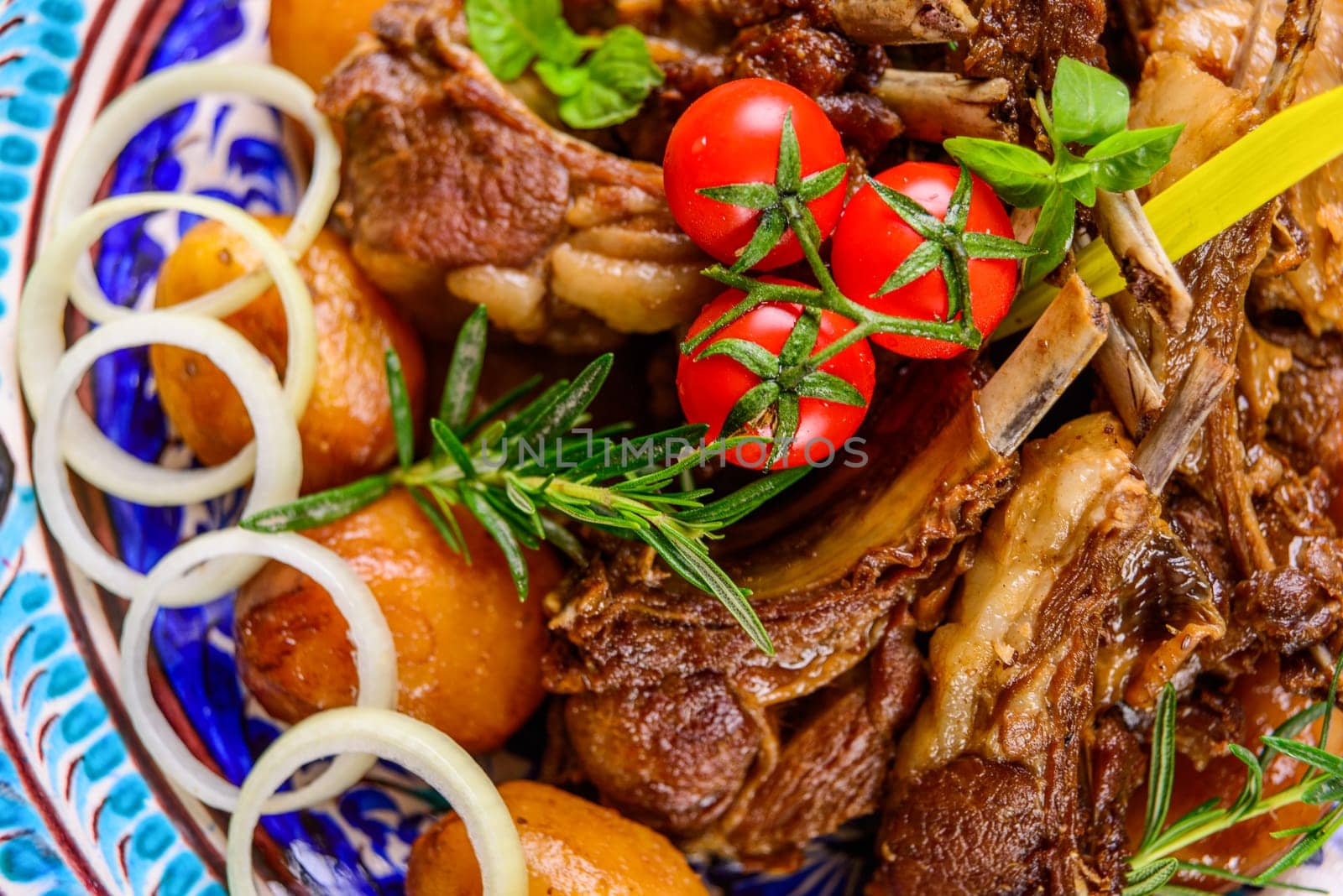 A top view of a national Uzbek dish with meat and potatoes by A_Karim