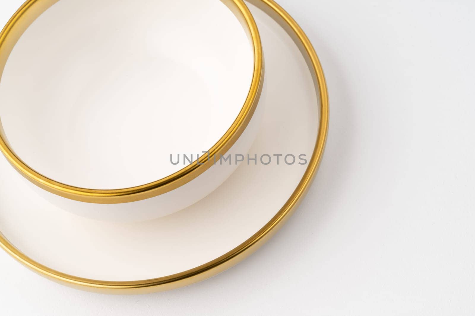 A set of white and brown ceramic plate and cup on a white background by A_Karim