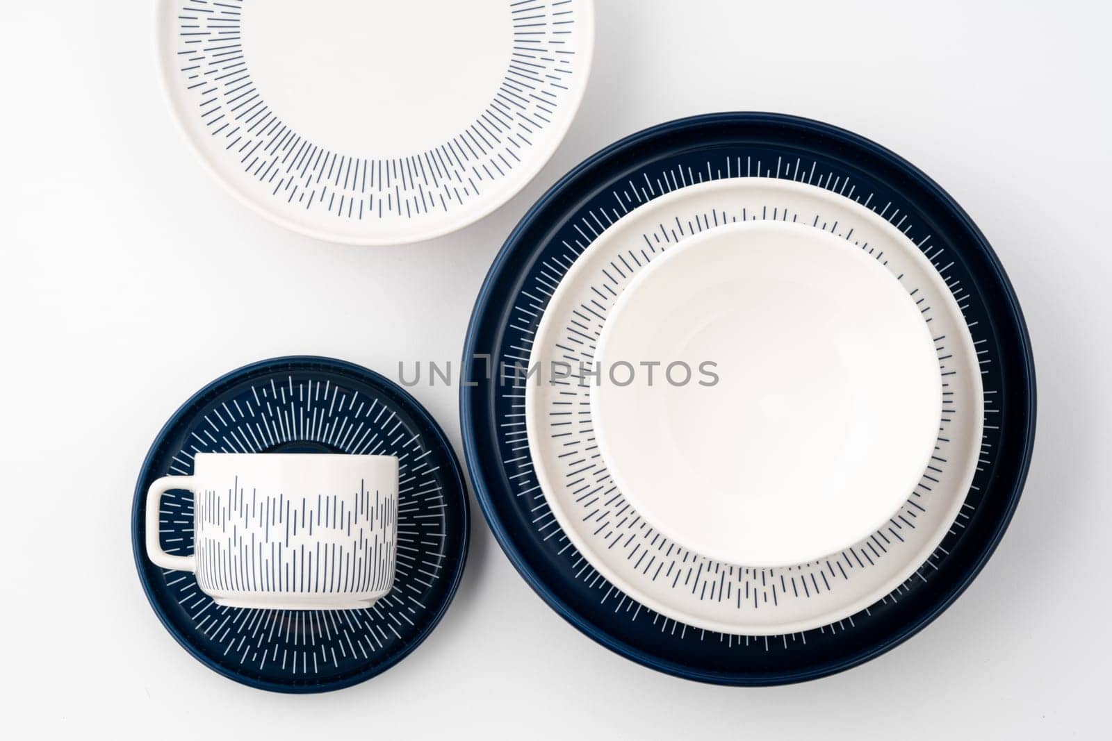 A set of blue and white luxury ceramic kitchen utensils on a white background