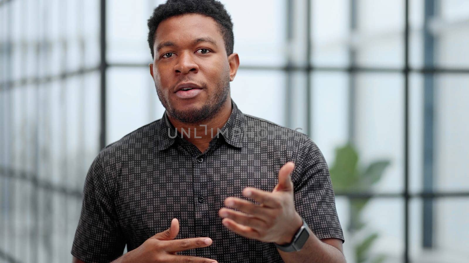 Indoor shot of a young confident black businessman looking serious