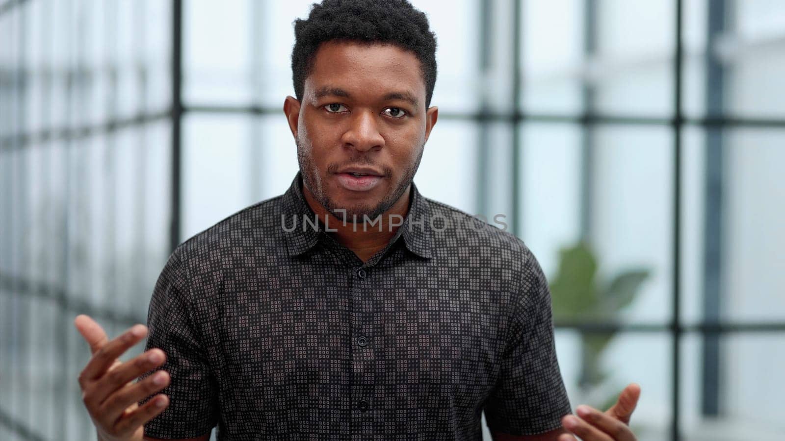 Indoor shot of a young confident black businessman looking serious