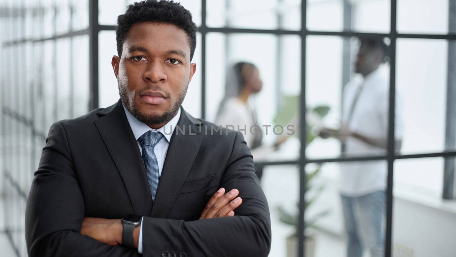 Portrait of a serious businessman in a black suit