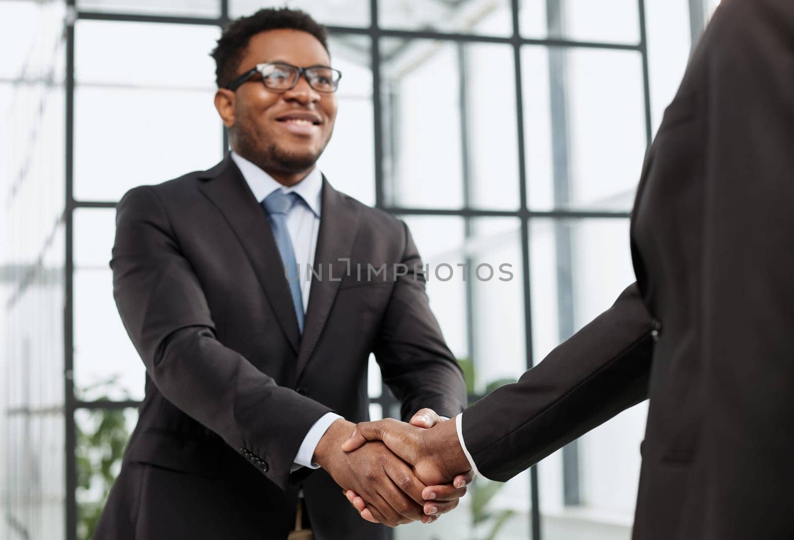 young black businessman shaking hands in the office
