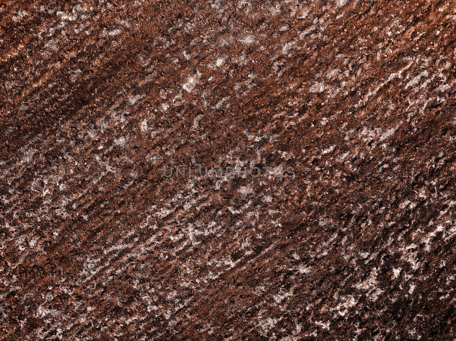 Arable land aerial view. Industrial agricultural farm, TOP VIEW: Aerial Drone Shot Flying Up On The Arable Land Area. Photo rows of soil before planting. View of land prepared for planting in spring.