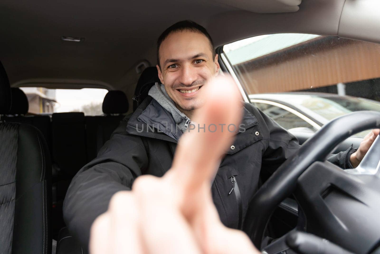Attractive elegant happy man in good car. High quality photo