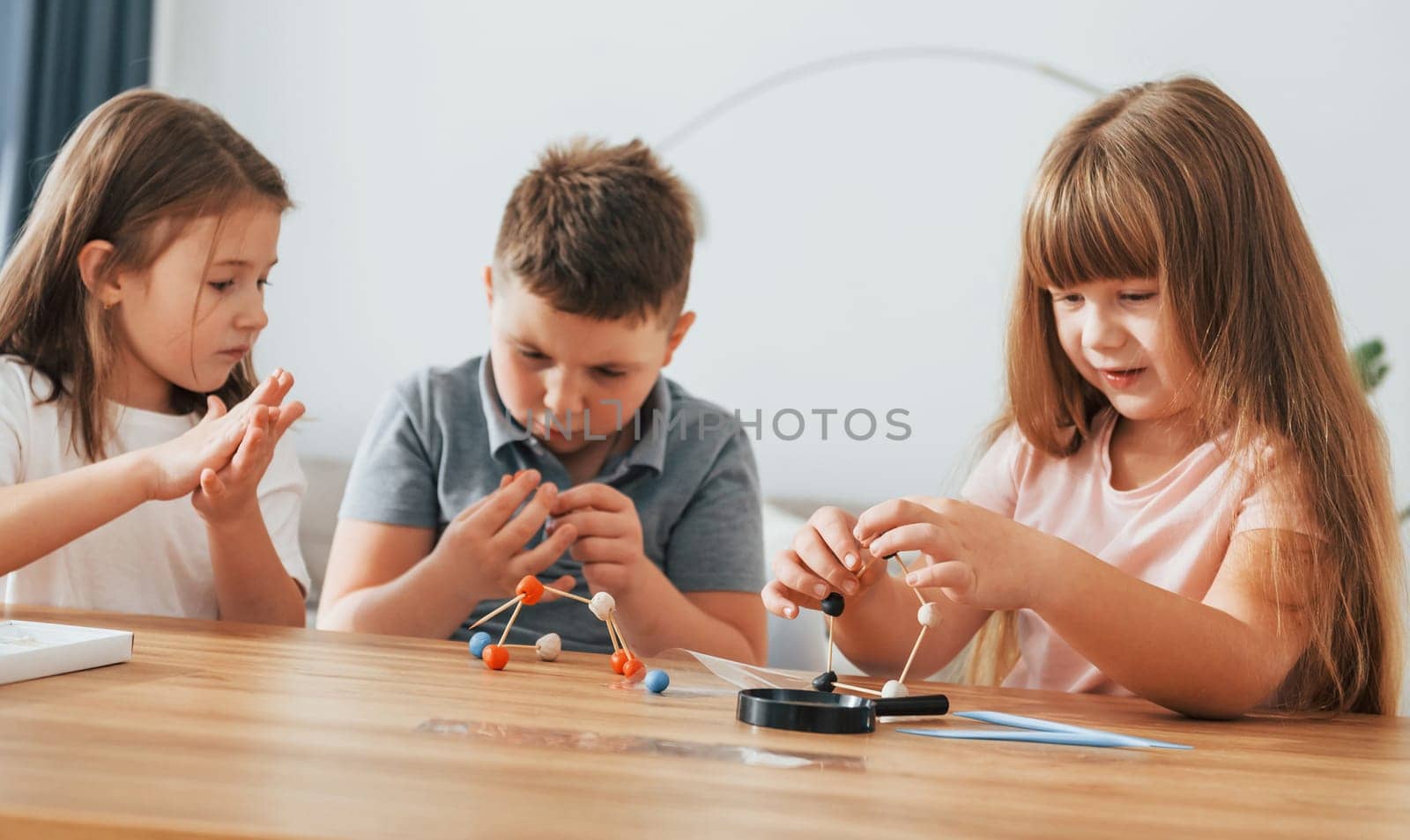 Kids having fun in the domestic room at daytime together.